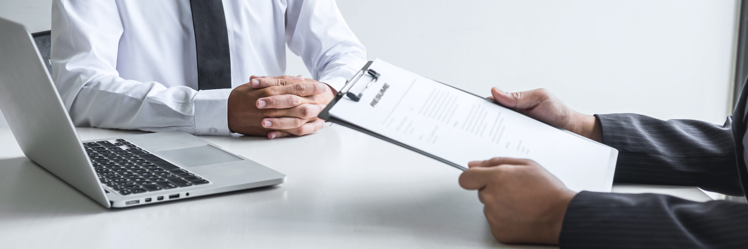 Employer reading a resume a job interview.